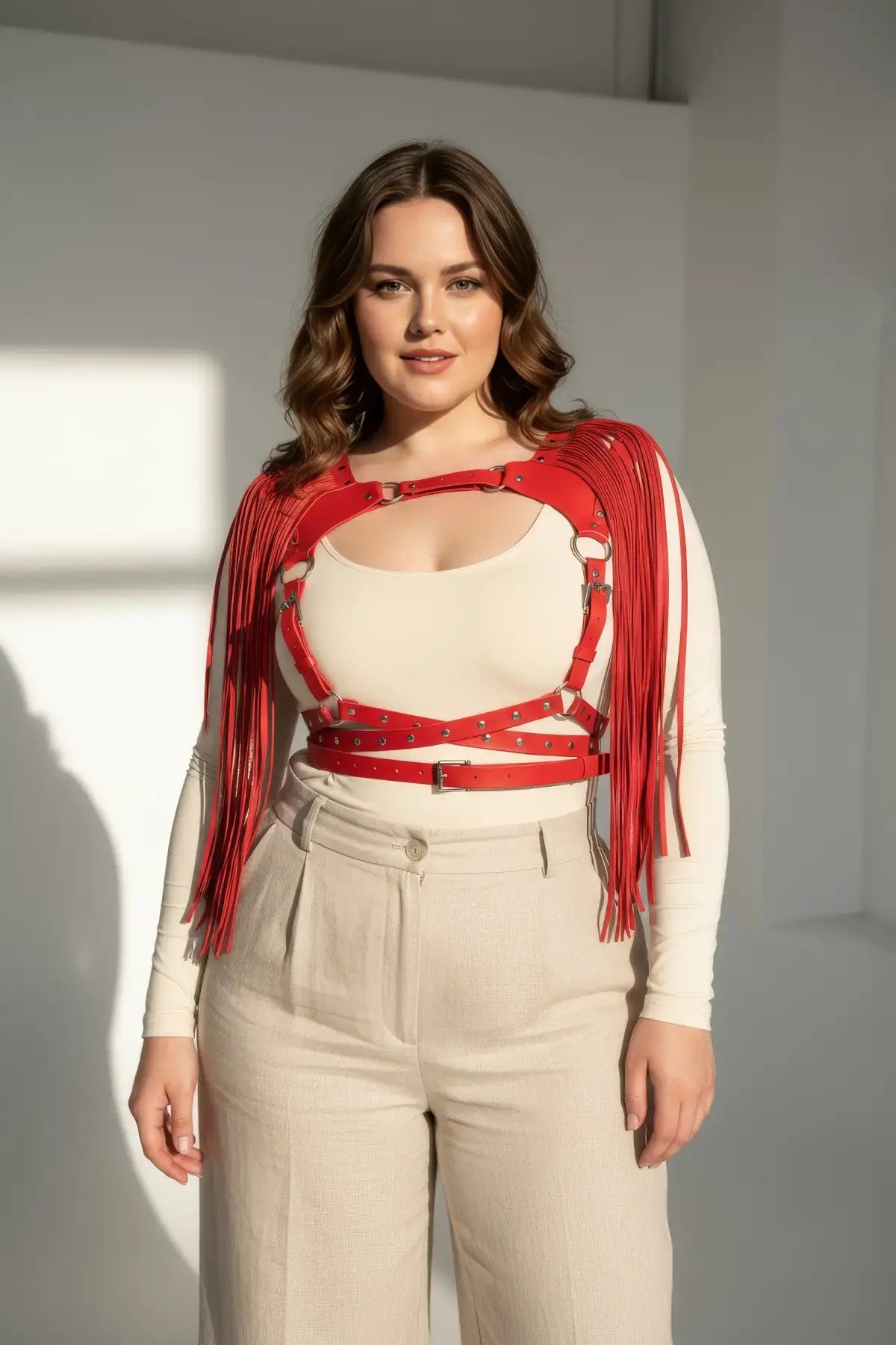 Plus-size red leather body harness with cascading tassels by HarnessClub