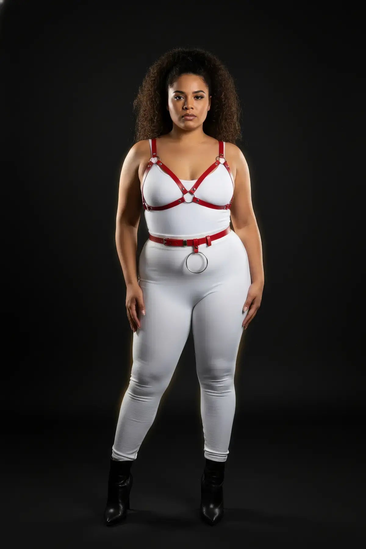 Plus-size red vegan-leather V-bralette and O-ring waist belt harness set by HarnessClub, two-piece.