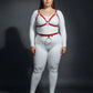 Plus-size red vegan-leather V-bralette and O-ring waist belt harness set, two-piece worn over a white bodysuit