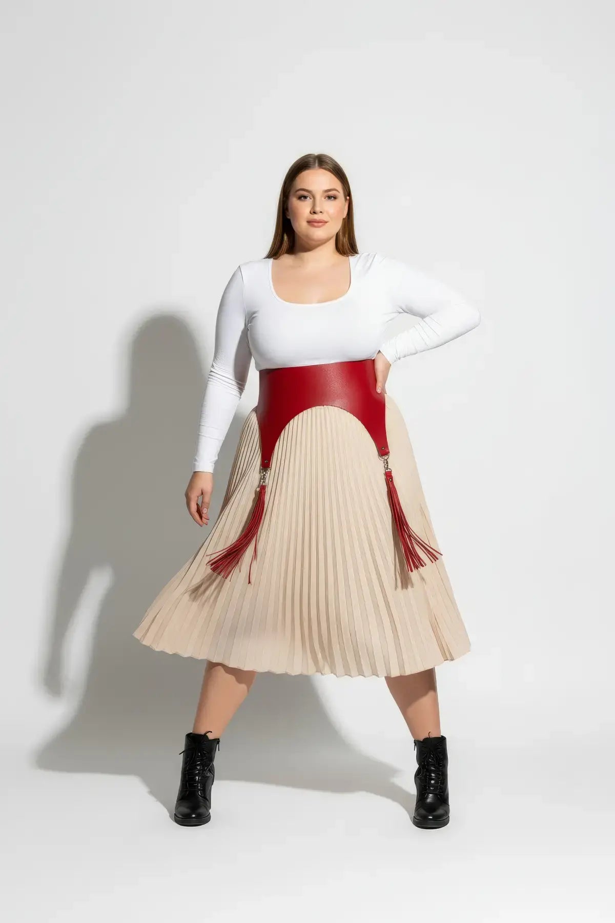 Plus Size Red Wide Corset Waist Belt with Tassels, vegan leather, worn over a beige pleated skirt