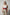 Plus size red vegan leather wide corset waist belt with tassels worn by model