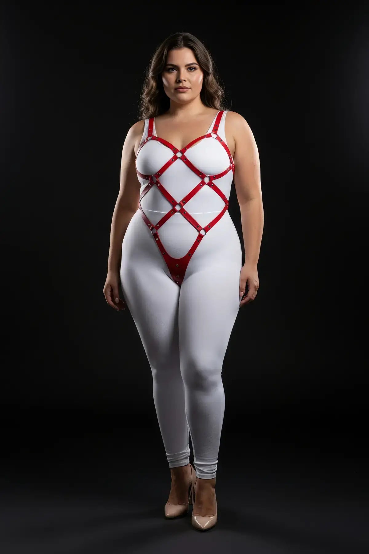 Plus size red wide diamond lattice body cage harness worn over a white bodysuit, vegan leather