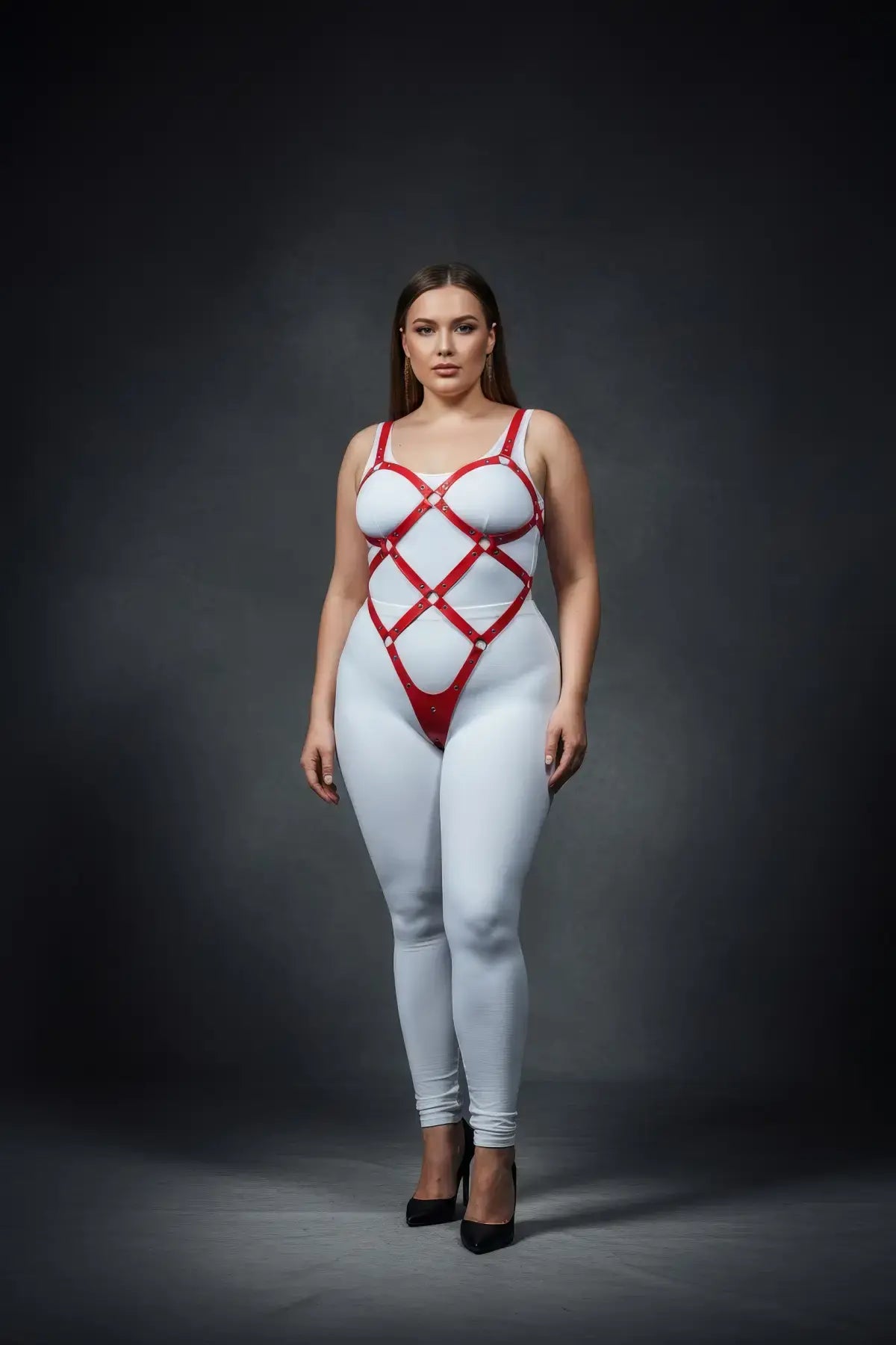 Plus-size red vegan leather body cage harness with wide diamond lattice worn over white bodysuit