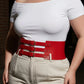 Plus-size red wide triple-buckle corset belt in vegan leather worn at the waist
