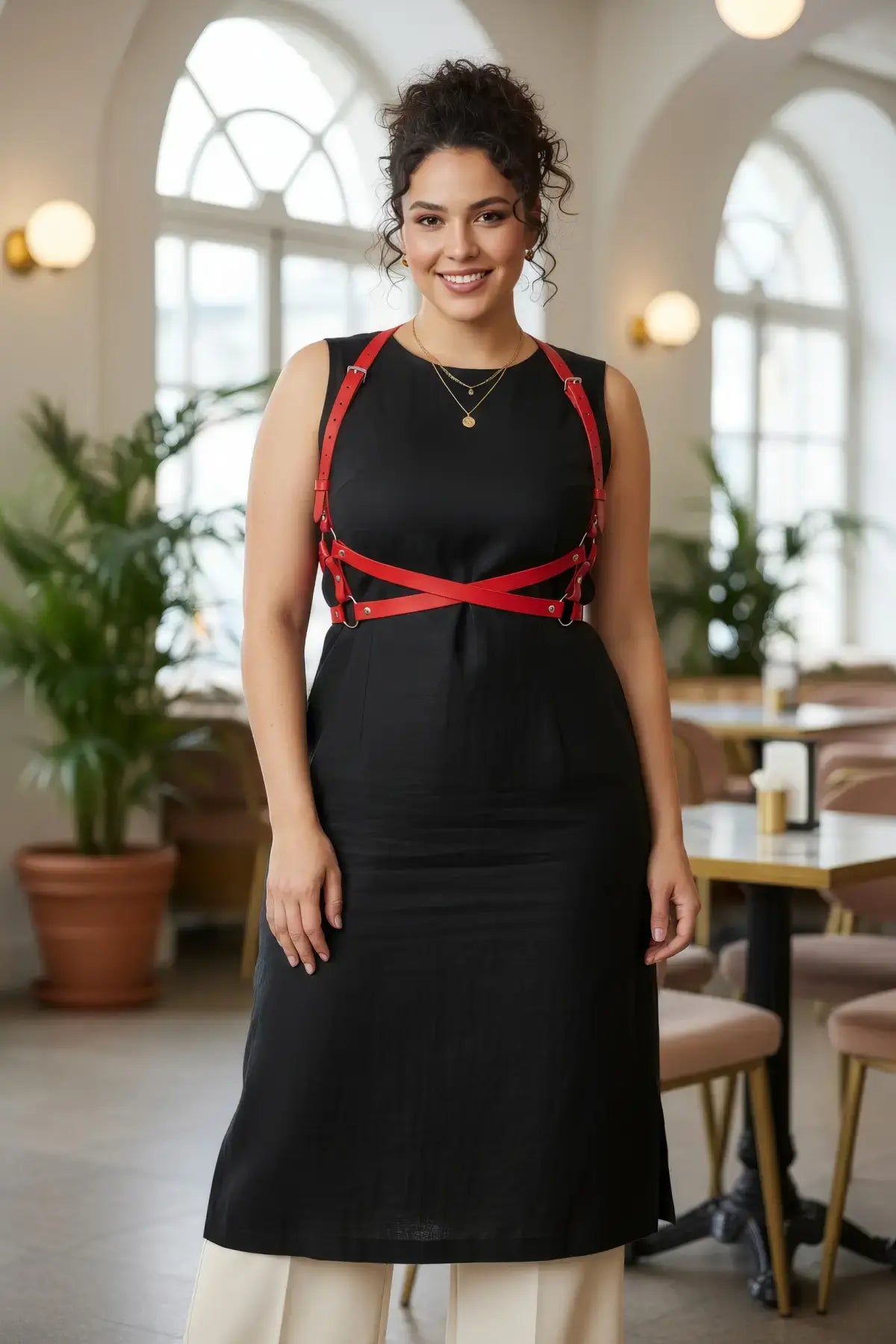 Plus-size red vegan-leather wrap cross-body harness worn over a black dress; HarnessClub.