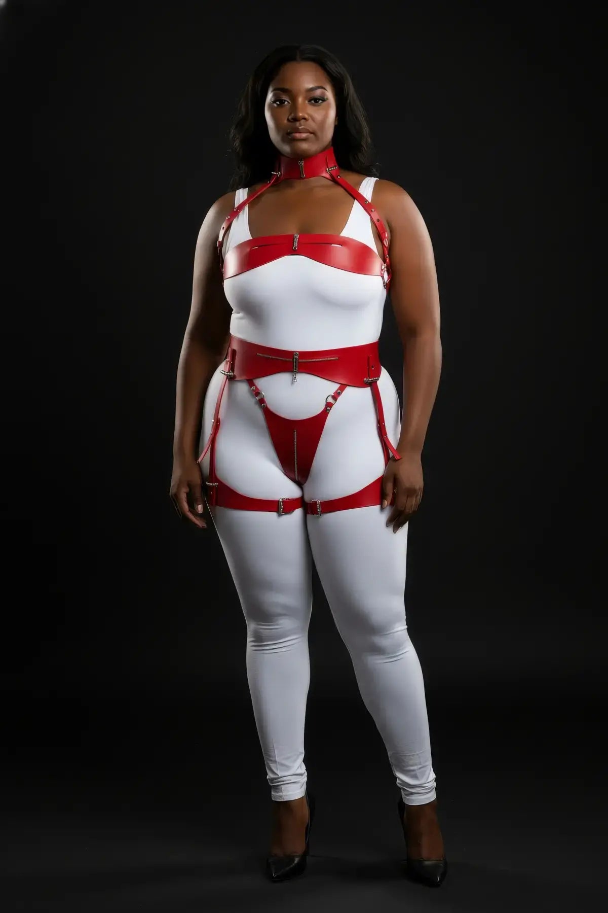 Plus-size red zip-detail three-piece harness with thigh garters worn over a white bodysuit