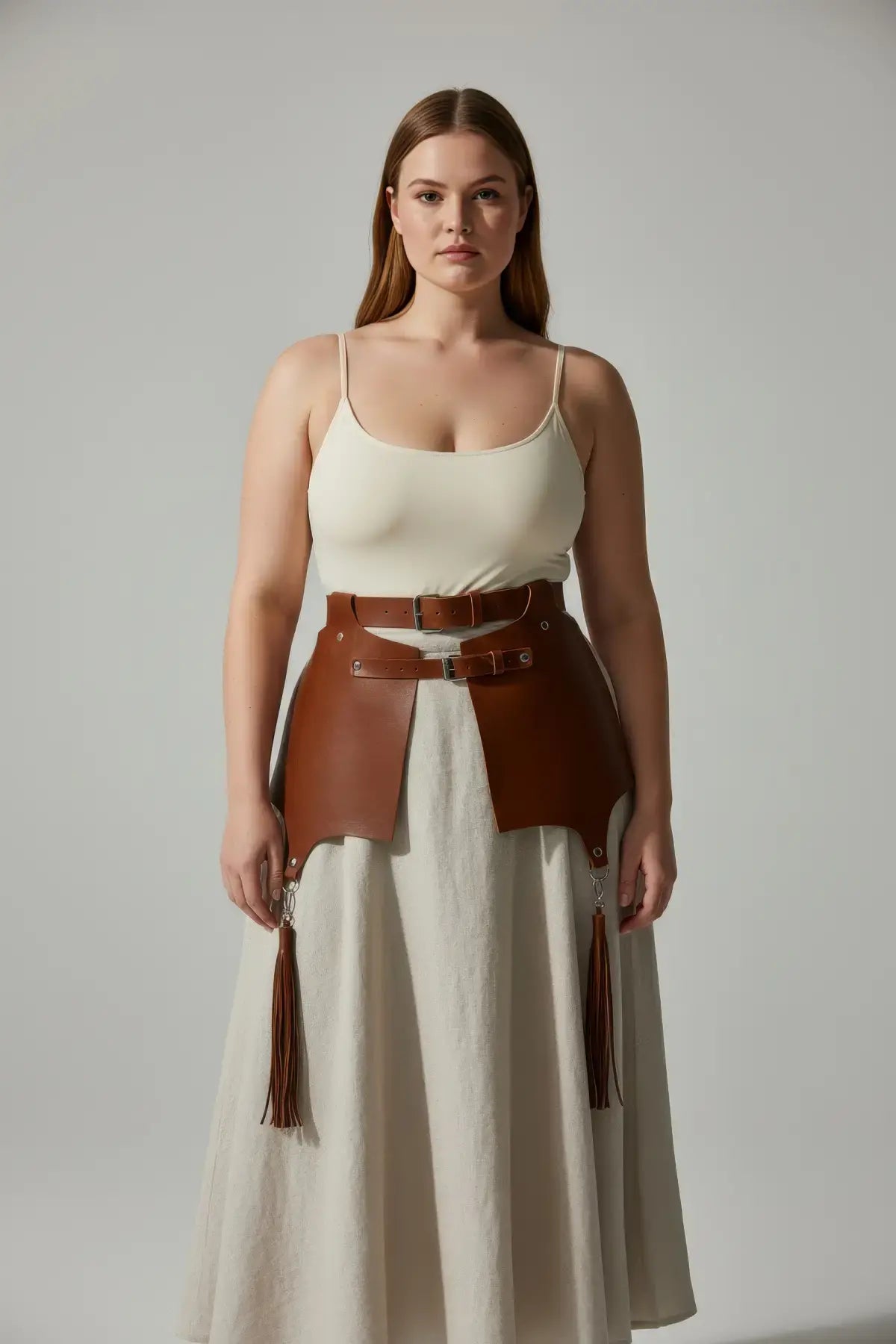 Plus-size tan leather corset-style waist harness with tassel fringe