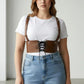 HarnessClub Plus Size tan corset harness with lace-up front and shoulder straps worn over a white tee
