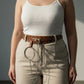 Plus-size tan vegan leather grommet belt with O-ring and chain detail.