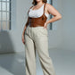Plus-size tan vegan-leather lace-up corset harness with shoulder straps worn over a white tank top