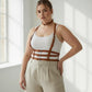 Plus-size tan vegan leather strappy body harness with choker and multiple buckles worn by model
