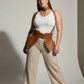 Plus size tan vegan leather suspender corset harness with choker and hip flaps worn over white top