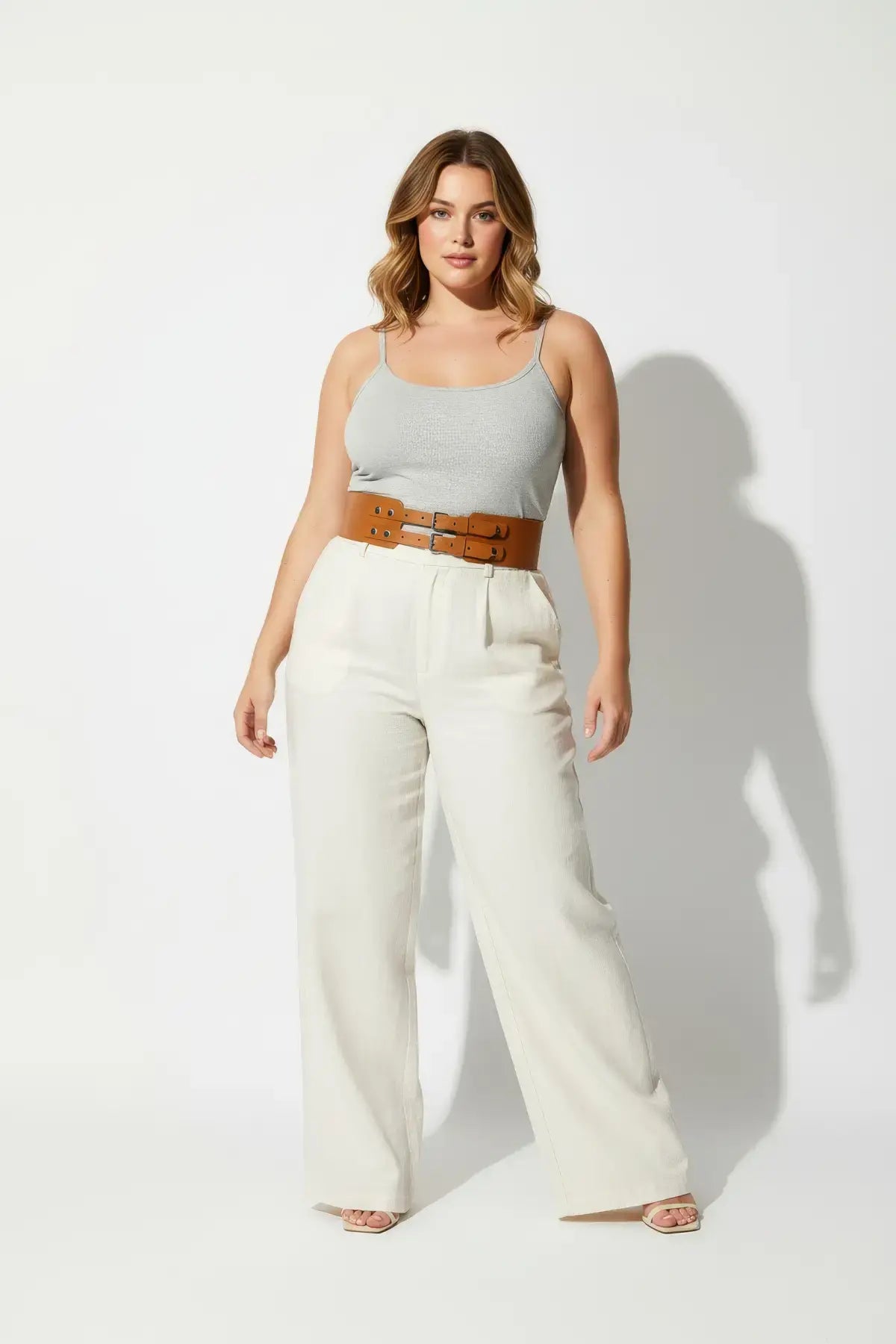 Plus Size Tan Wide Double-Buckle Leather Waist Belt worn over a gray top.