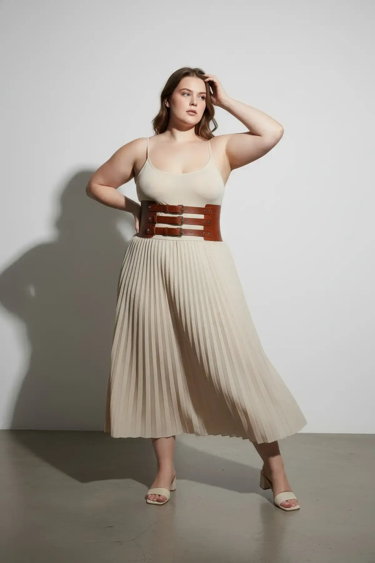 Plus Size Tan Wide Triple-Buckle Corset Belt by HarnessClub in vegan leather, worn at the model's waist.