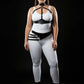 HarnessClub plus-size vegan leather underbust harness with asymmetric sash hip belt, two-piece on model