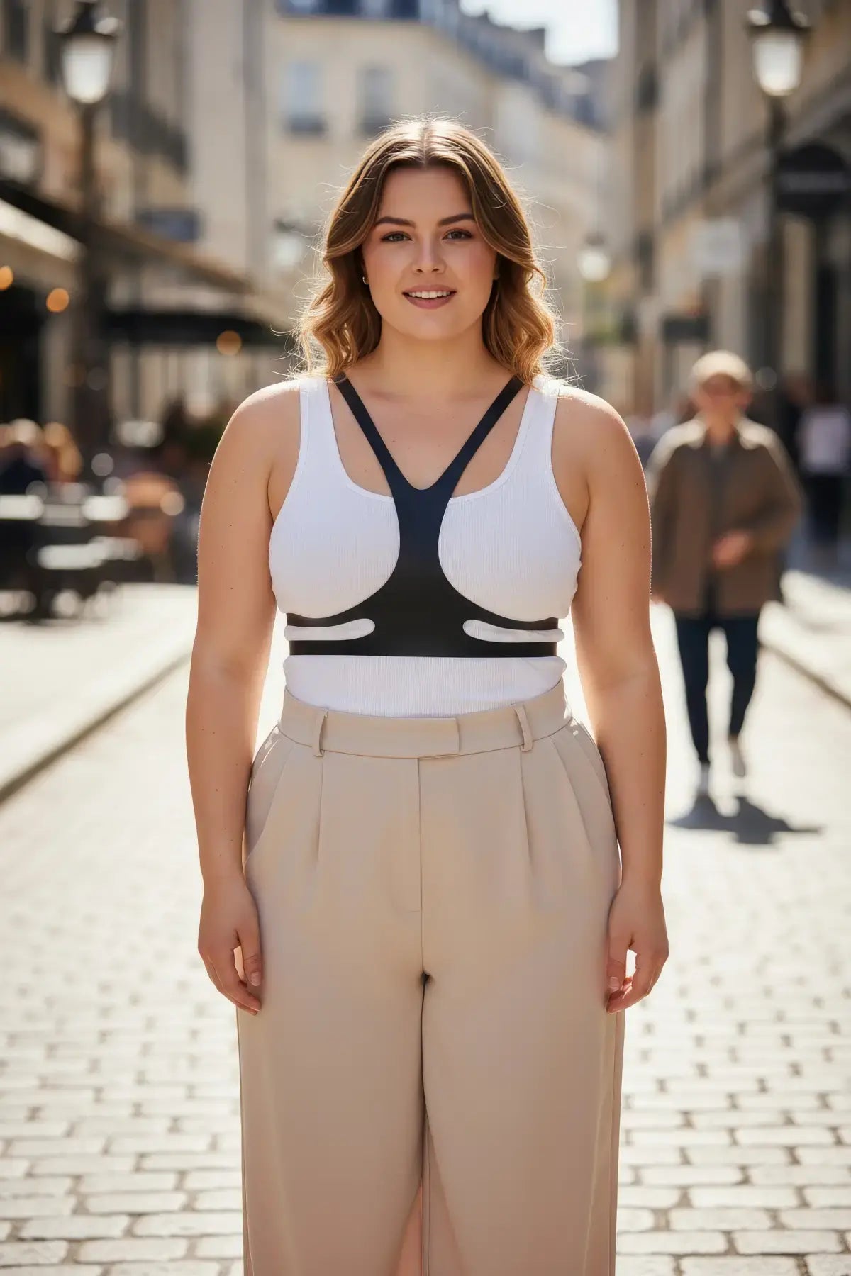 Plus-size vegan leather body harness belt, black, worn over a white tank top