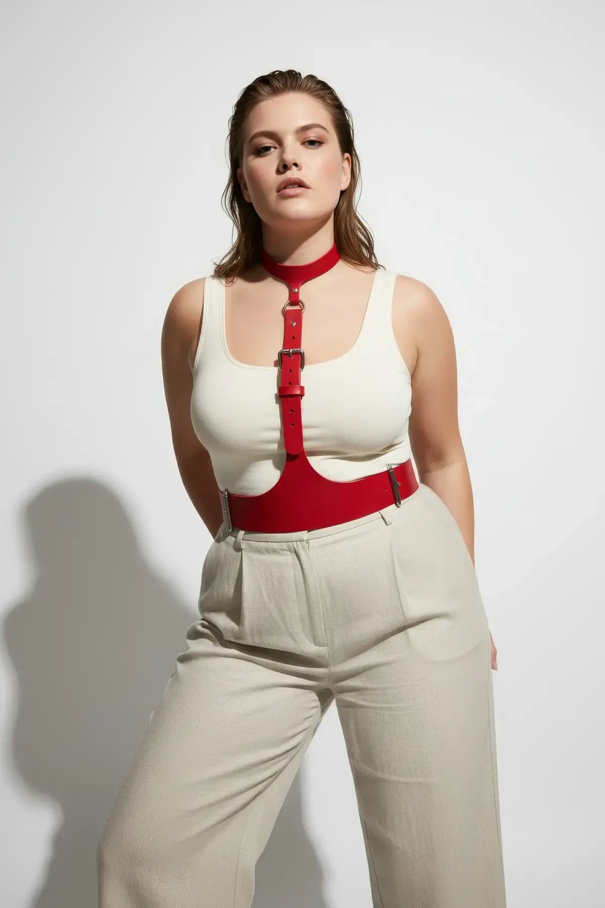 Plus Size Vegan Leather Corset Harness, red with metal buckles, worn over a white top