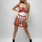 HarnessClub red cage-strap O-ring mini skirt, vegan leather festival harness style worn over white top
