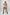 HarnessClub red cage-strap O-ring mini skirt, vegan leather festival harness style worn over white top