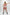 Red cage-strap O-ring vegan leather mini skirt by HarnessClub, festival-ready.