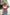 Red lace-up underbust corset belt with straps in vegan leather.