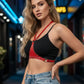 Red studded vegan leather halter chest harness with silver studs worn over a black top