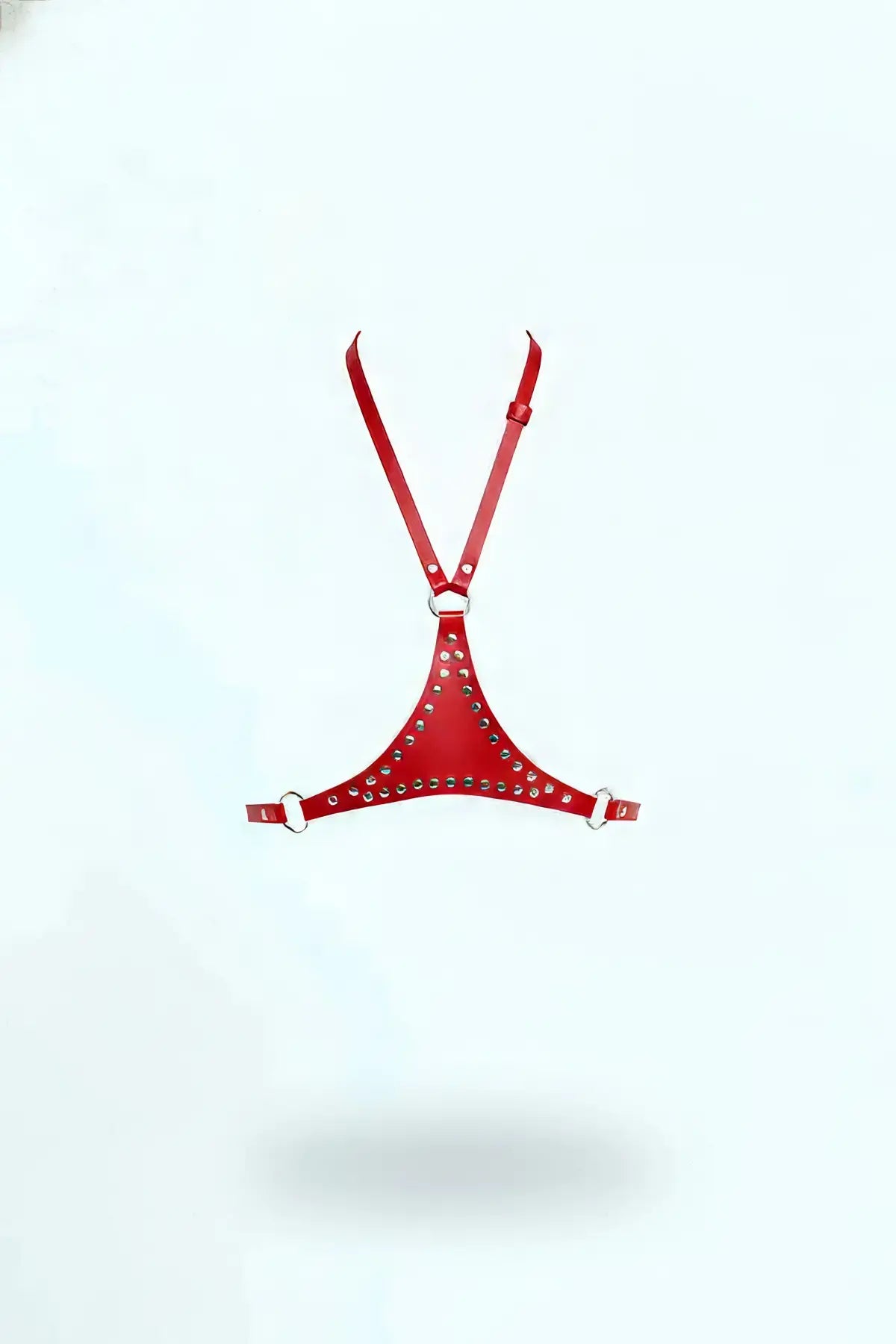 Red studded vegan leather triangle chest harness with adjustable straps and metal rings.