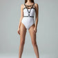 Womens black vegan leather crossover chest-strap underbust harness worn by model