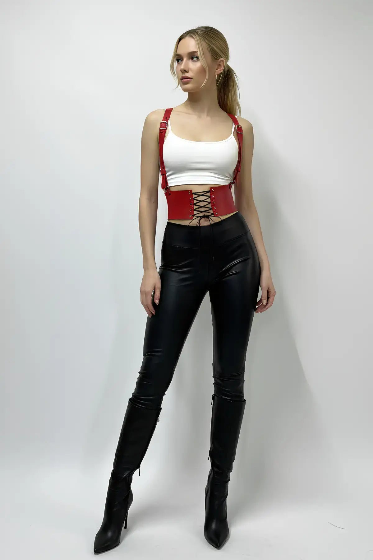 Red vegan-leather corset waist belt with lace-up and suspenders on a model