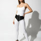 Womens black studded corset belt worn at the waist; vegan leather with silver rivet detailing.