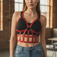 Womens red vegan-leather open-cage bust harness with studded straps