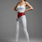 Women's red studded corset belt by HarnessClub, vegan leather waist accessory.