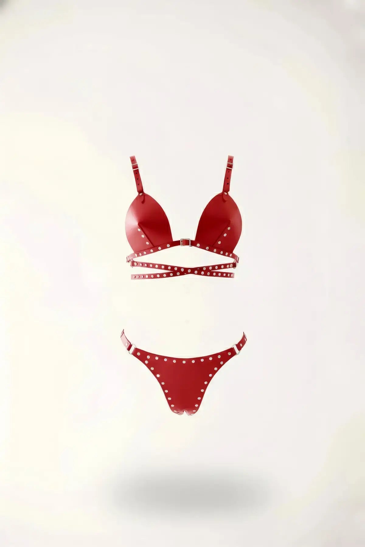 Red studded triangle bralette and thong two-piece set in vegan leather.